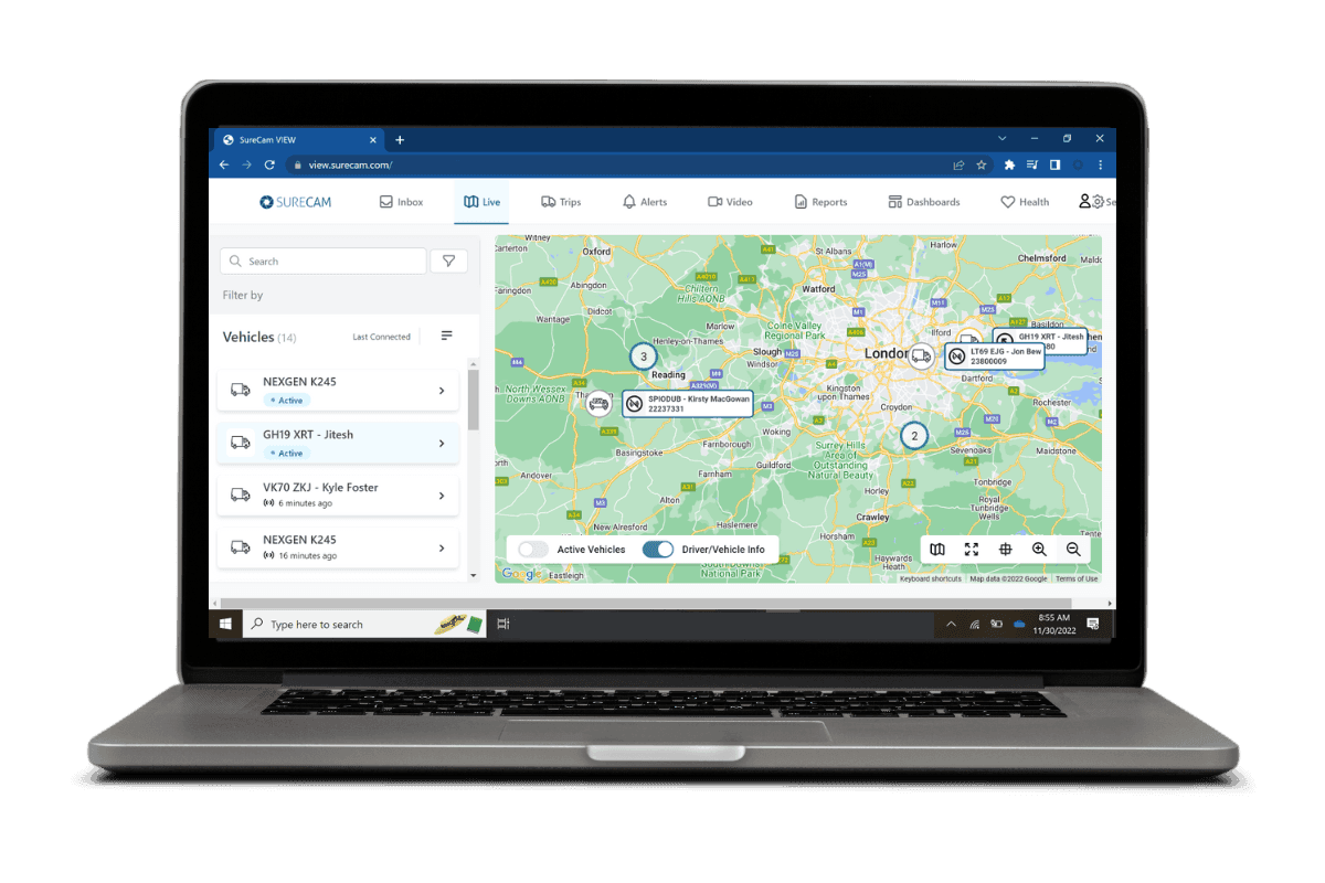 Laptop screen displaying a vehicle tracking dashboard with a map and a list of active vehicles.